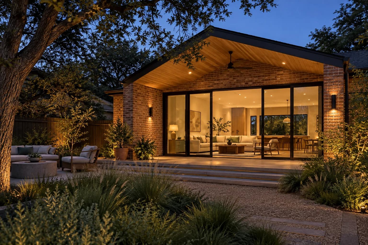 Concept image of a warm brick Bouldin living addition viewed from the garden